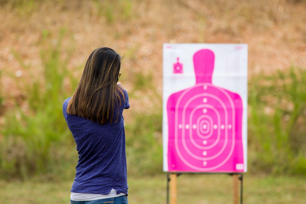 Female shooting at range