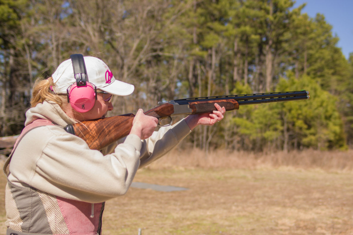 Woman practicing gun safety
